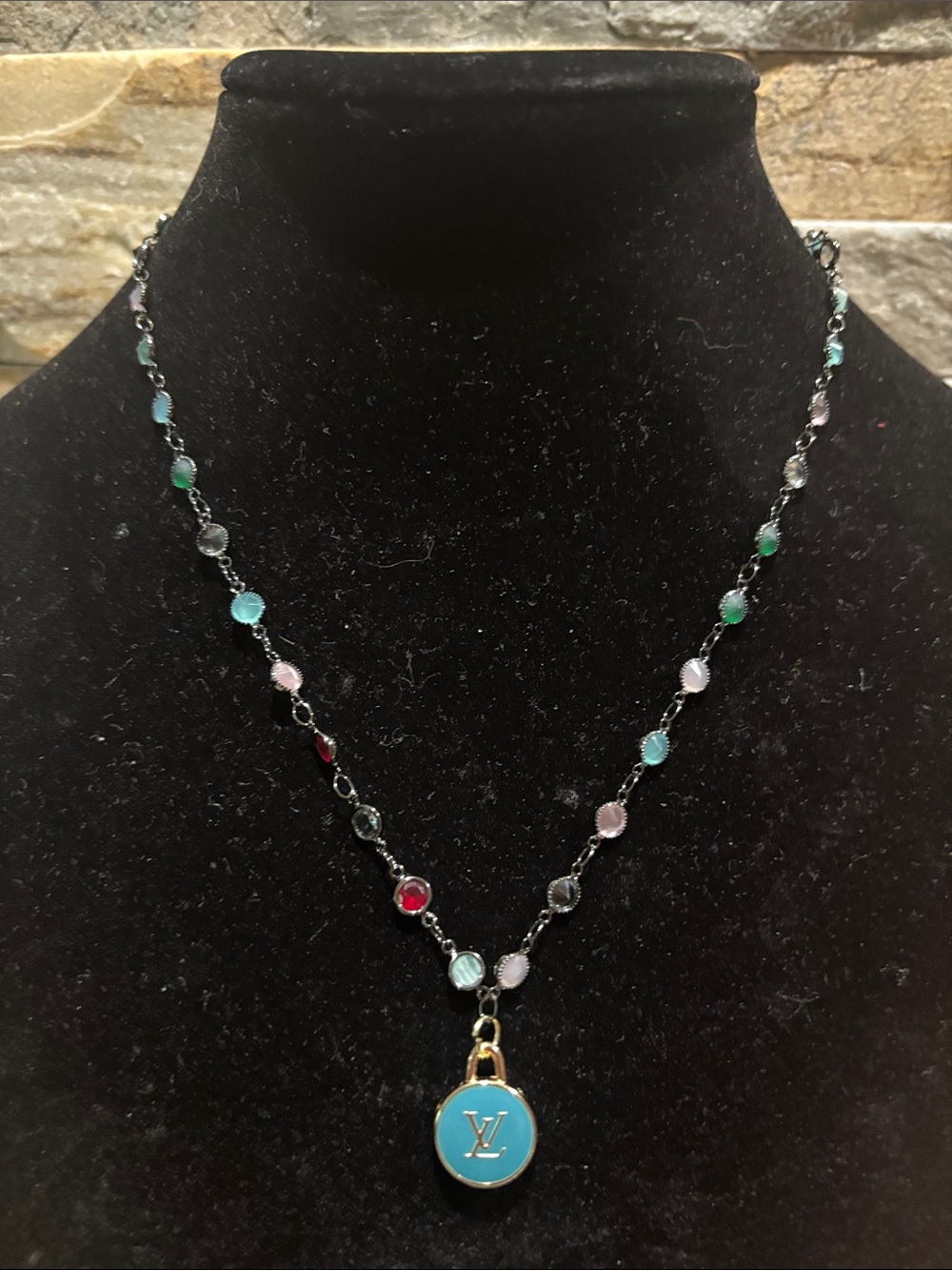 Multicolor Beaded Necklace with Turquoise LV skittle charm.